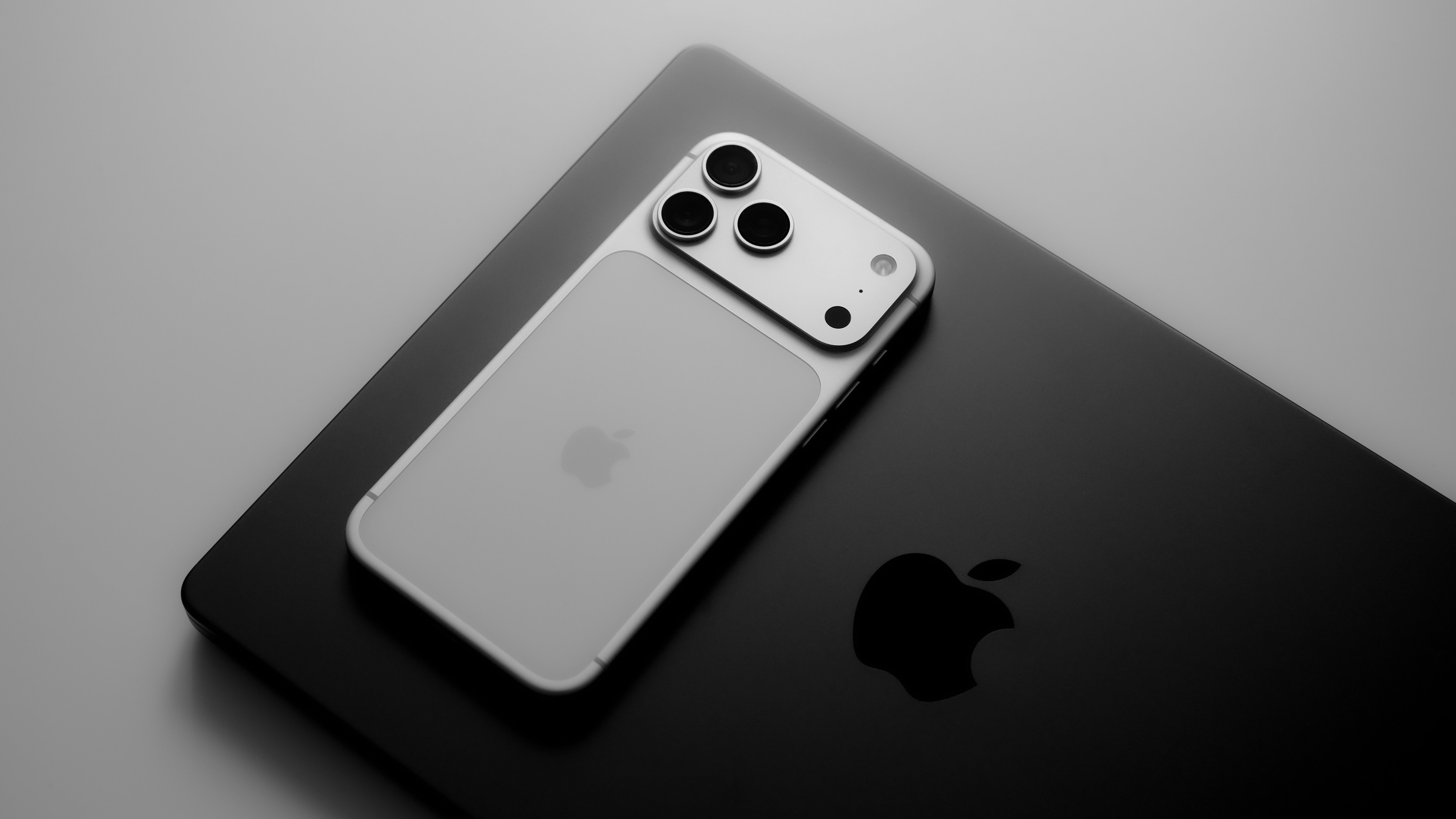 Picture of an iPhone 17 Pro and MacBook