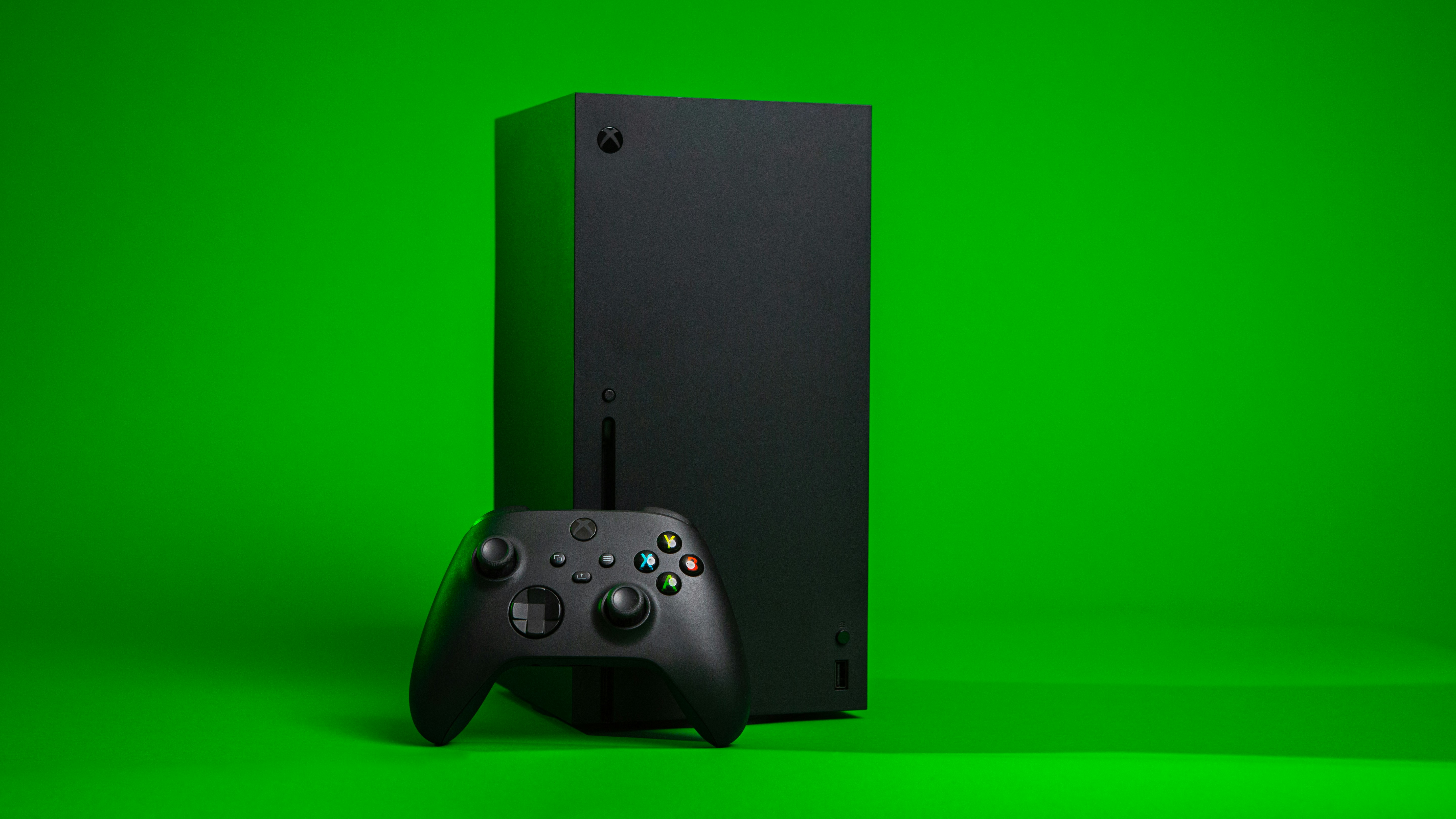 A picture of the Xbox Series X with a controller.