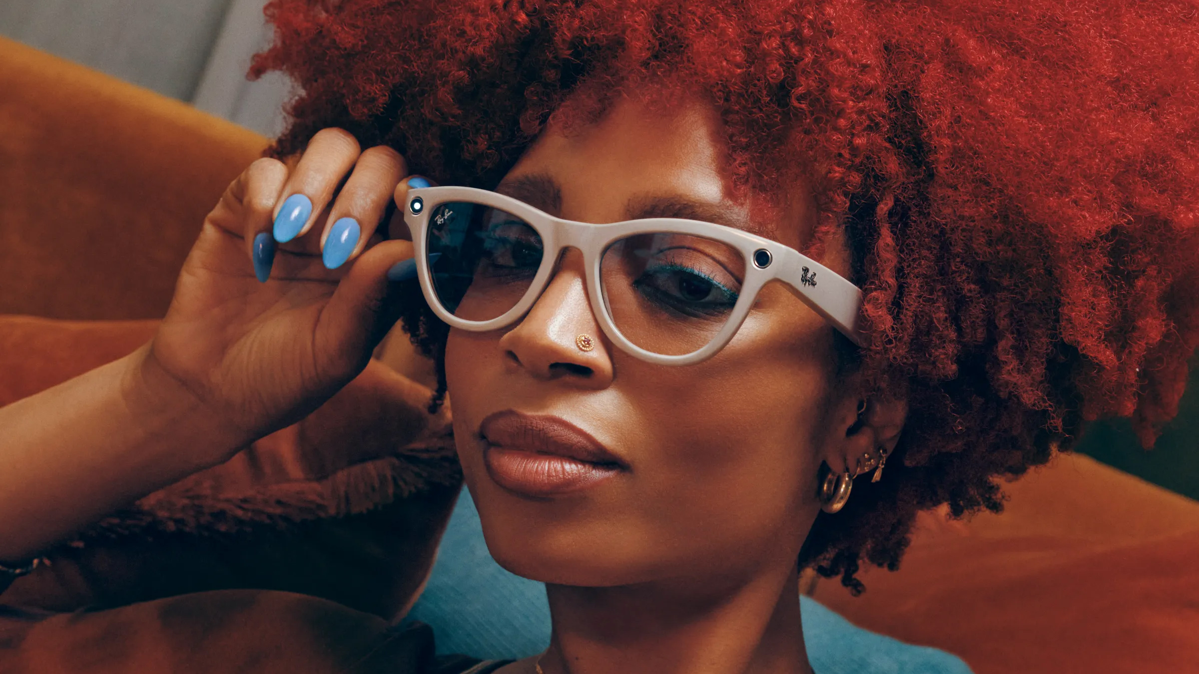 A woman wearing the Meta Ray-Ban smart glasses