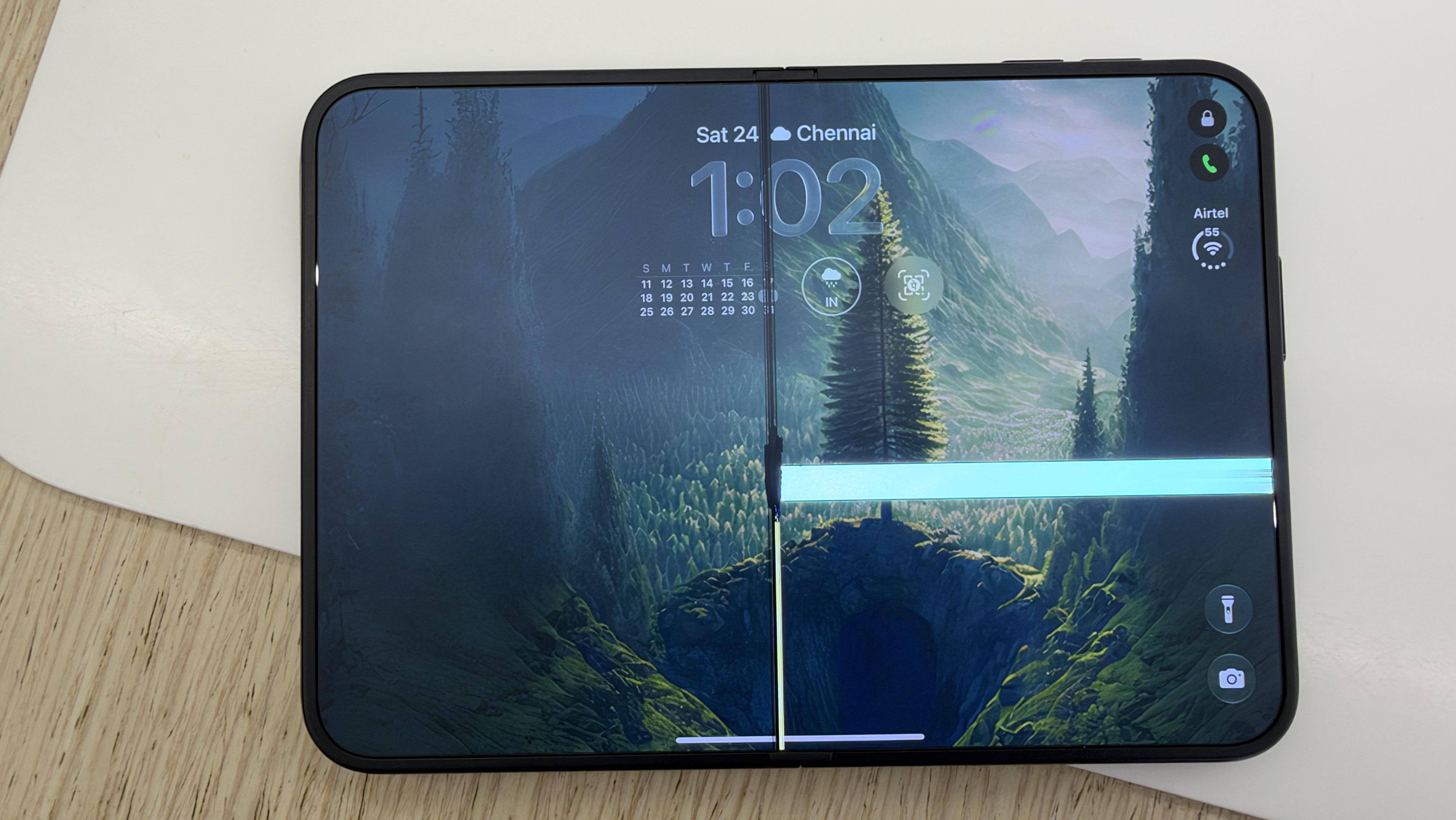 Cracked inner display of an iPhone Duo